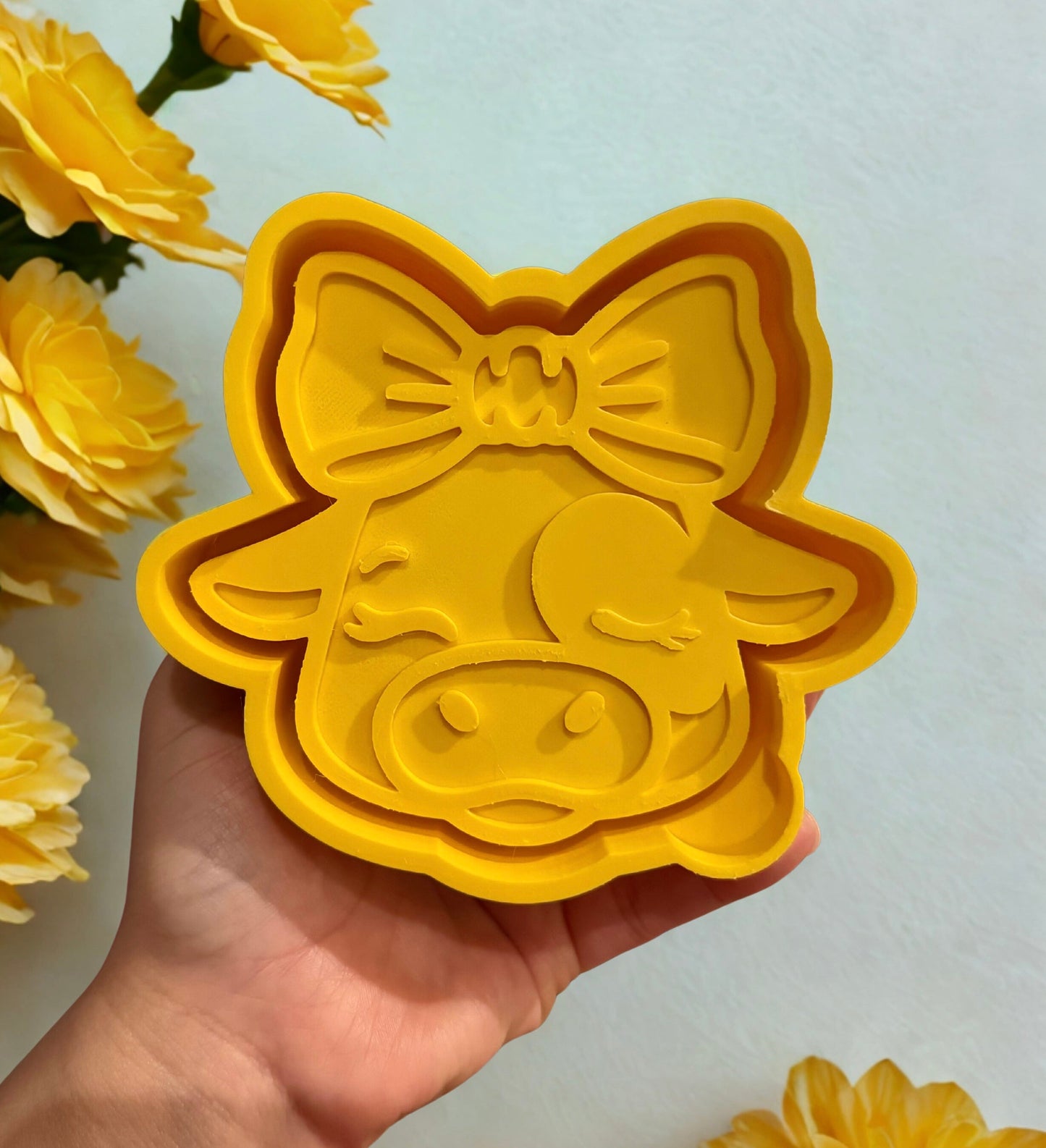 Cow head with a bow